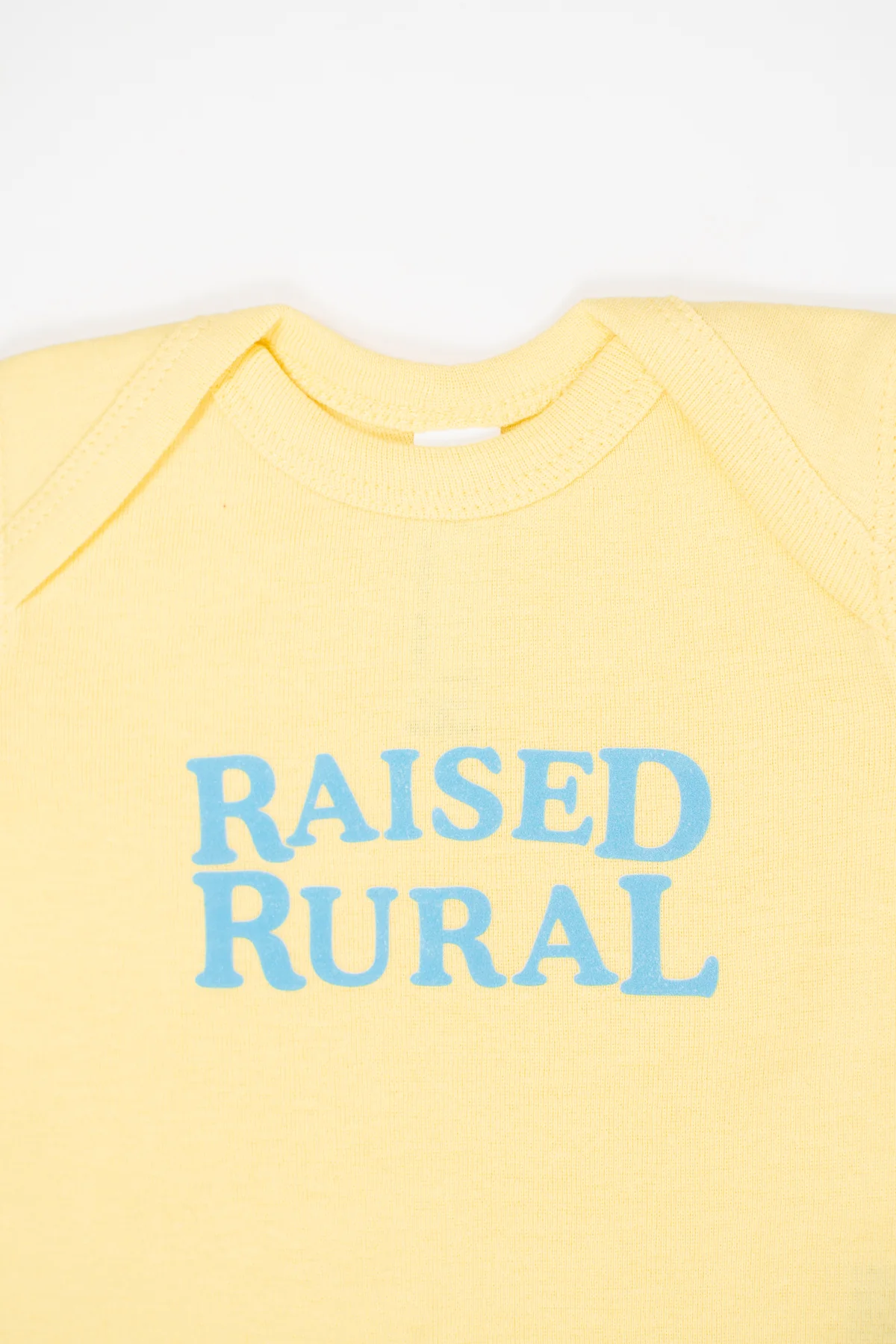Raised Rural' Yellow Onesie - Image 3